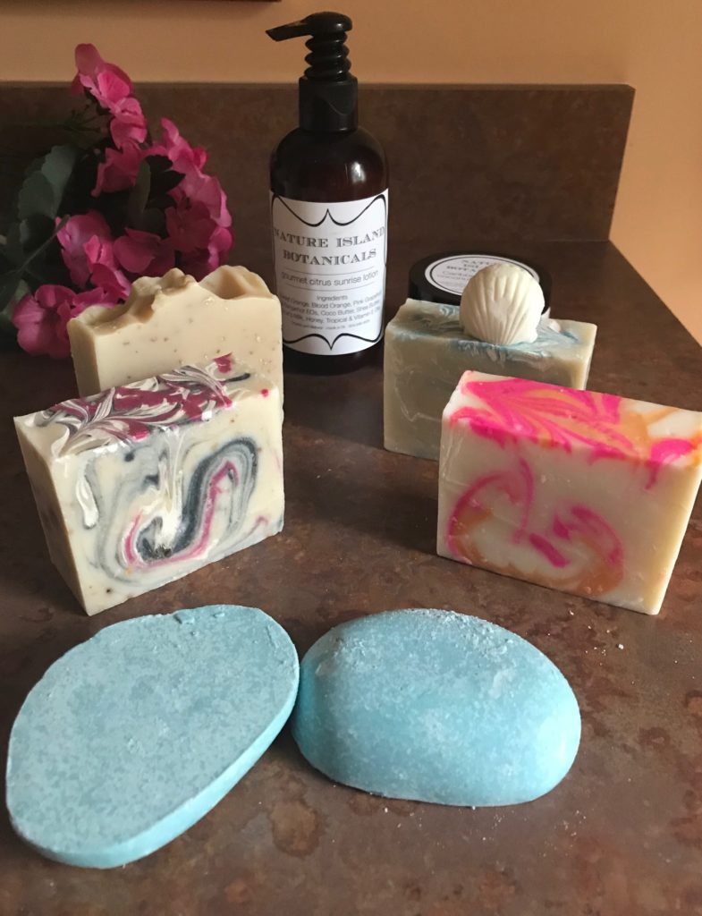 unwrapped soaps and salt exfoliating bars as well as body lotions from Nature Island Botanicals, neversaydiebeauty.com