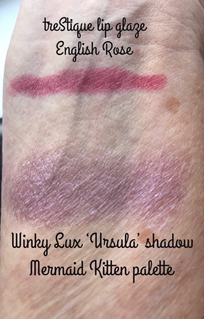 swatches of treStique Lip Glaze in rosy red shade English Rose and purple shimmer eyeshadow Ursula from the Winky Lux Mermaid Kitten palette, neversaydiebeauty.com
