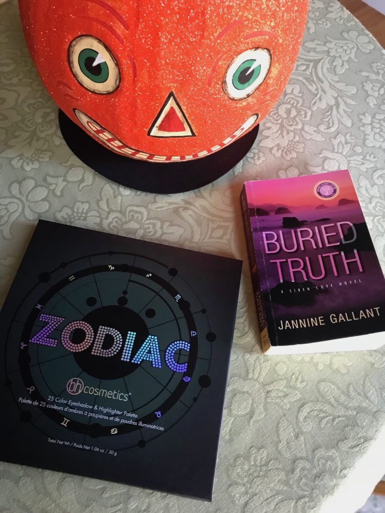 BH Cosmetics Zodiac Shadow Palette, Buried Truth novel with Halloween pumpkin, neversaydiebeauty.com