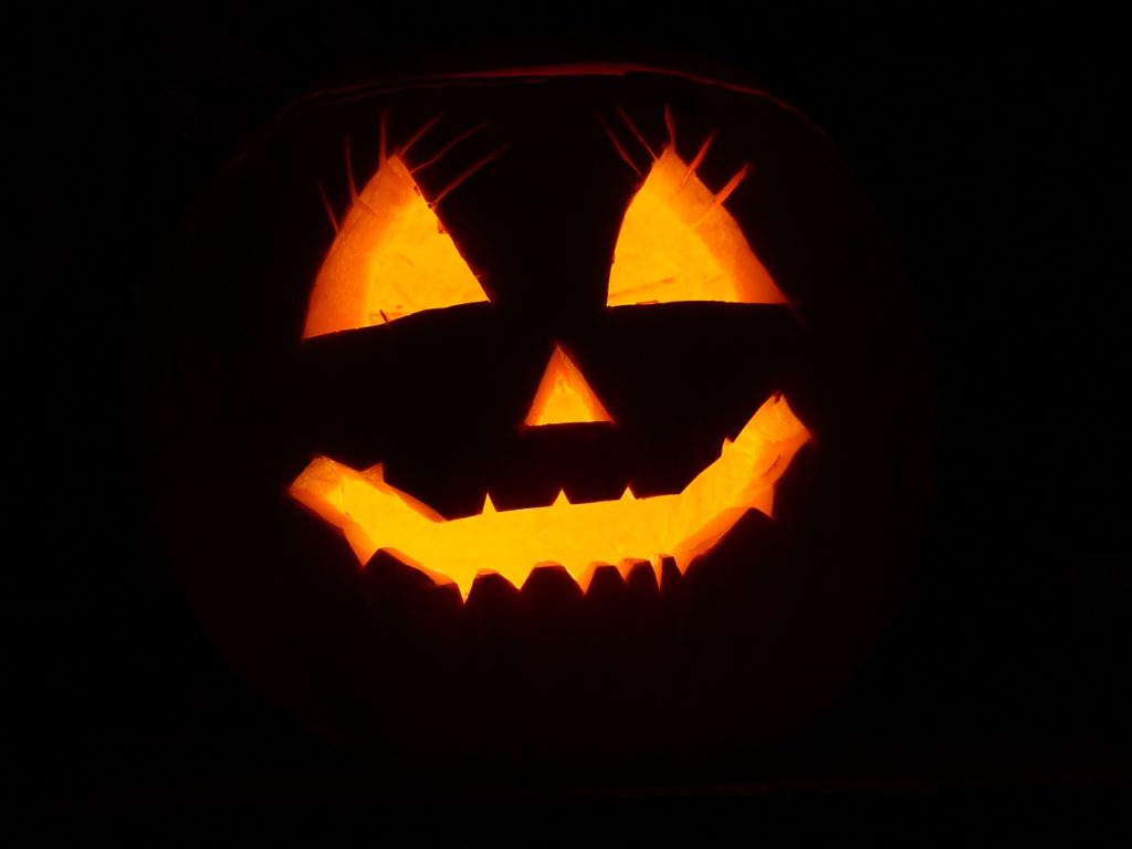 smiling pumpkin glowing in the dark