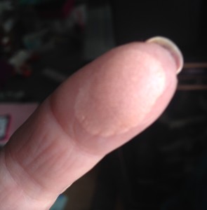 finger swatch of Cindy Lou Manizer Highlighter from theBalm neversaydiebeauty.com @redAllison