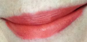 my lips wearing Youngblood Cosmetics Intimatte Lipstick in "Flirt" a peachy coral shade neversaydiebeauty.com @redAllison