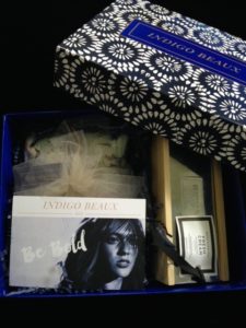 Indigo Beaux subscription box, open showing the product card Be Bold neversaydiebeauty.com @redAllison