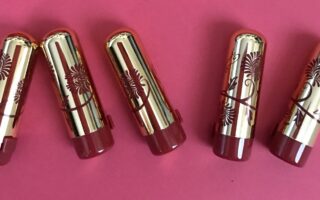 Besame Mini Lipsticks in gold cases with red flower decorations neversaydiebeauty.com