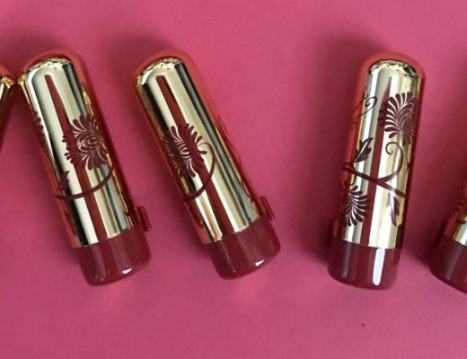 Besame Mini Lipsticks in gold cases with red flower decorations neversaydiebeauty.com