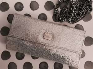 IT Cosmetics for Ulta silver clutch holding All That Glitter makeup brush set, neversaydiebeauty.com