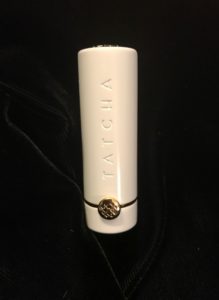hero shot of TATCHA Sunrise lipstick in white metal case, neversaydiebeauty.com