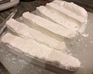 cutting marshmallows into strips, then cubes, neversaydiebeauty.com