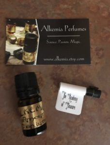 Alkemia Perfume Oil, Conjure in amber bottle, The Academy of Pleasure sample with Alkemia business card, neversaydiebeauty.com