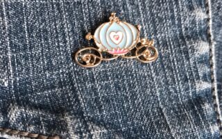 enameled pin of Cinderella's coach from Femme de Bloom, neversaydiebeauty.com