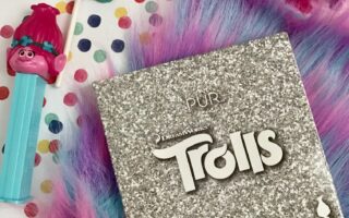 PUR Cosmetics Trolls Shadow Palette in outer packaging wi Poppy Pez dispenser & chocolate lollipop, neversaydiebeauty.com