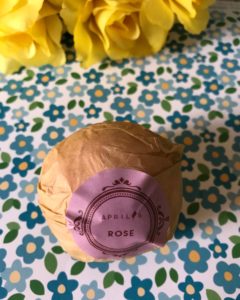 Aprilis rose bath bomb in paper wrapper with identifying label, neversaydiebeauty.com