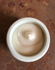 open jar to show the cream of the Aveda Tulasara Wedding Masque for Eyes, neversaydiebeauty.com