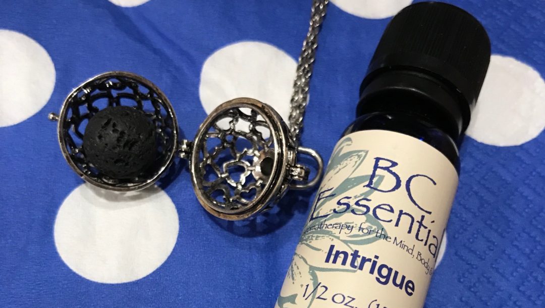 BC Essentials essential oil, Intrigue, along with a lava ball from an aromatherapy necklace, neversaydiebeauty.com