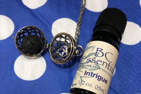 BC Essentials essential oil, Intrigue, along with a lava ball from an aromatherapy necklace, neversaydiebeauty.com