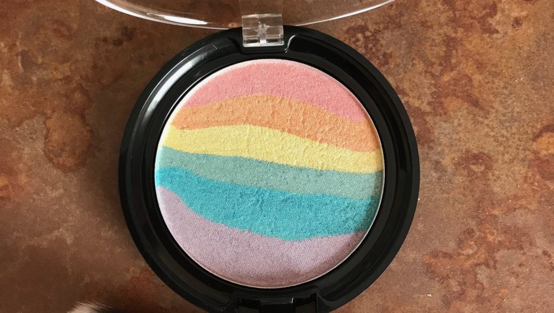 Wet N Wild Color Icon Rainbow Highlighter, shade Unicorn Glow, open to show colored stripes, neversaydiebeauty.com