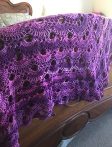 crocheted virus shawl made with Red Heart's Unforgettable yarn in Petunia, pink/purple shades, neversaydiebeauty.com
