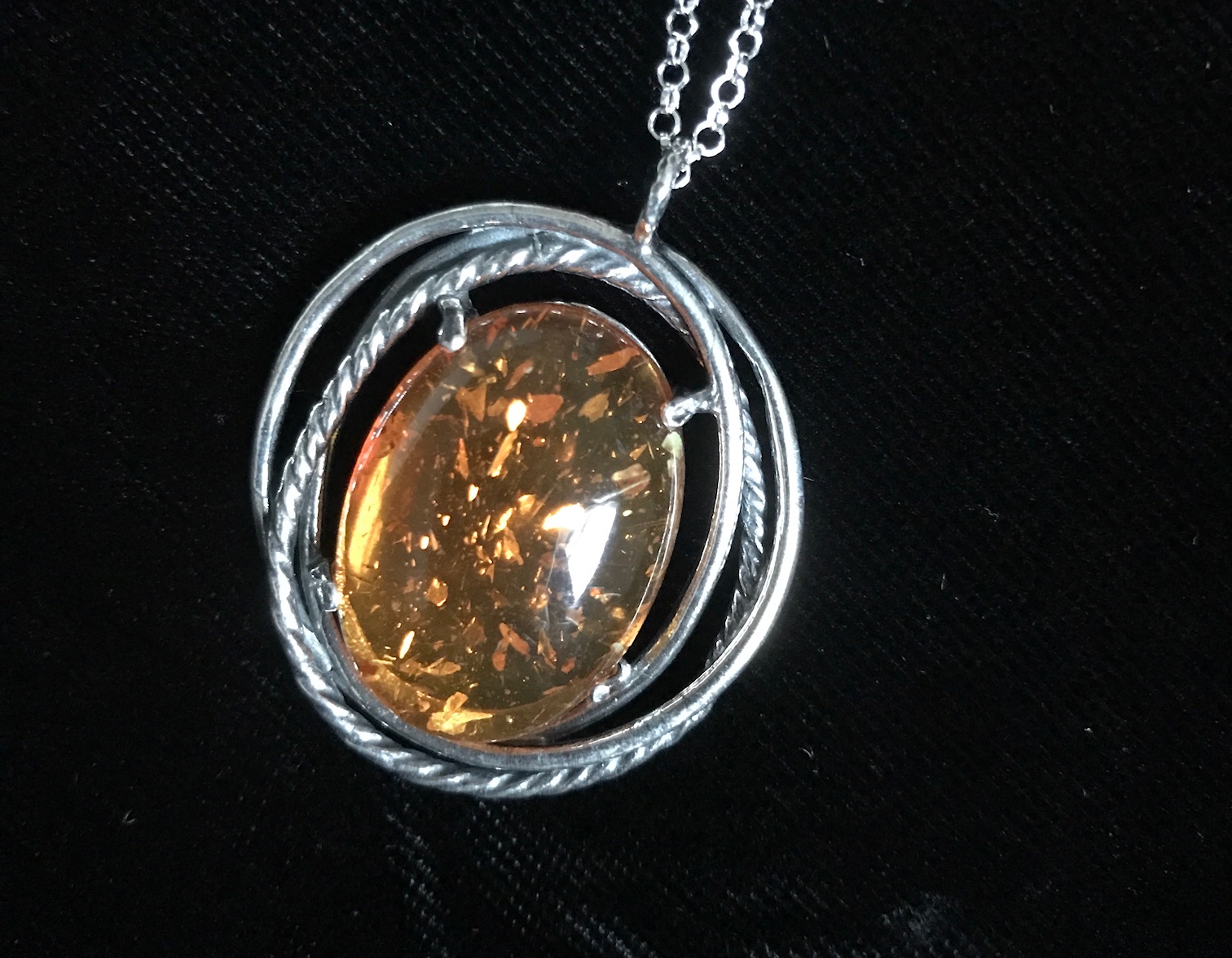 detail of amber pendant from Uno Alla Volta, neversaydiebeauty.com