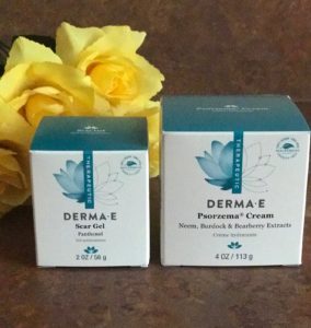 Derma E Scar Gel and Psorzema Cream in their outer packaging, neversaydiebeauty.com