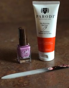 Parodi Daily Moisturizing Hand Cream tube with nail polish and file, neversaydiebeauty.com