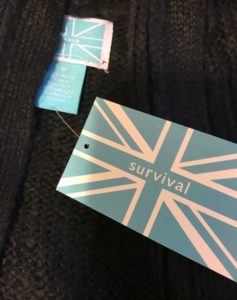 Survival clothing brand logo tag, neversaydiebeauty.com