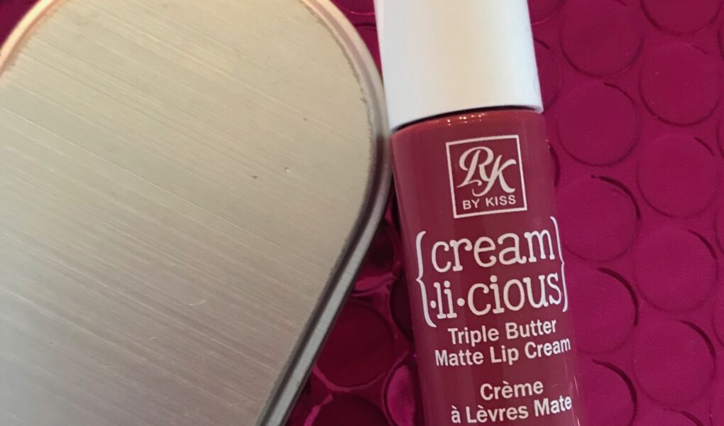 a tube of RK by KISS Cream.li.cious Triple Butter Matte Lip Cream in Berry In Love, neversaydiebeauty.com