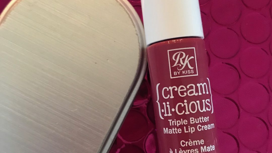 a tube of RK by KISS Cream.li.cious Triple Butter Matte Lip Cream in Berry In Love, neversaydiebeauty.com