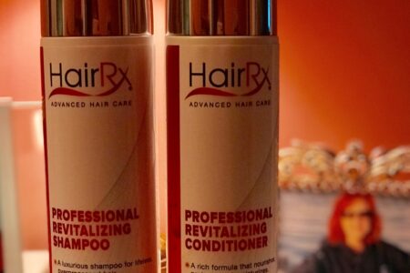 closeup of HairRx Shampoo and Conditioner bottles, neversaydiebeauty.com