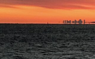 view of Boston in the distance from Niles Beach Gloucester MA, neversaydiebeauty.com