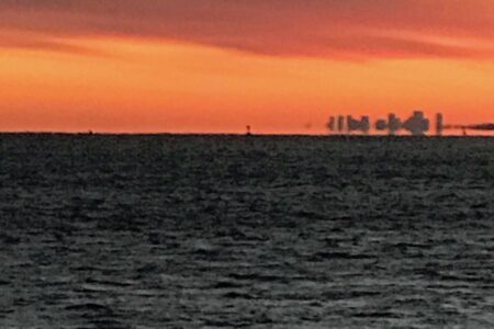 view of Boston in the distance from Niles Beach Gloucester MA, neversaydiebeauty.com