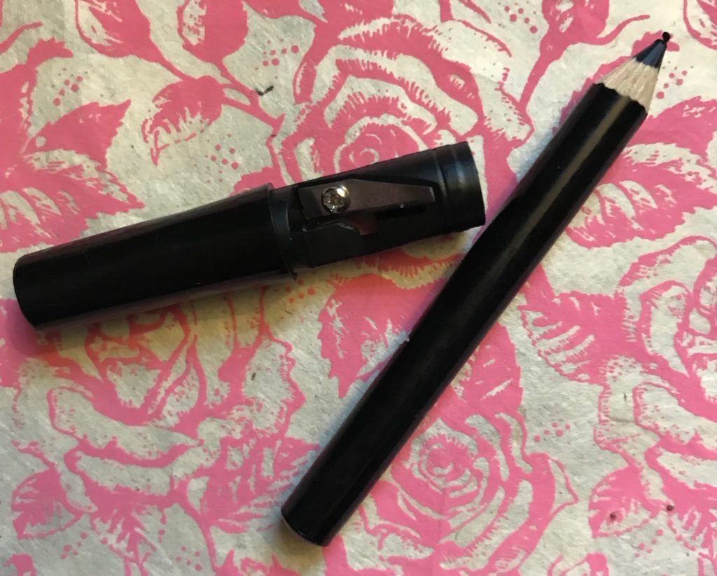 closeup of black eyeliner pencil and sharpener, neversaydiebeauty.com