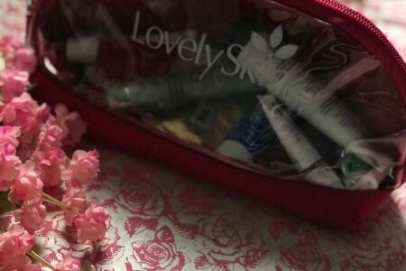 makeup bag with skincare travel samples from LovelySkin.com, neversaydiebeauty.com