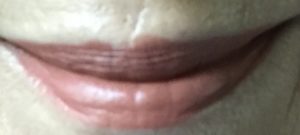 lip swatch of Lay Over, a ColourPop Lux lipstick that a neutral-pinkish beige, neversaydiebeauty.com