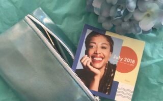 Ipsy bag for July 2018 with theme card, neversaydiebeauty.com