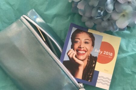 Ipsy bag for July 2018 with theme card, neversaydiebeauty.com