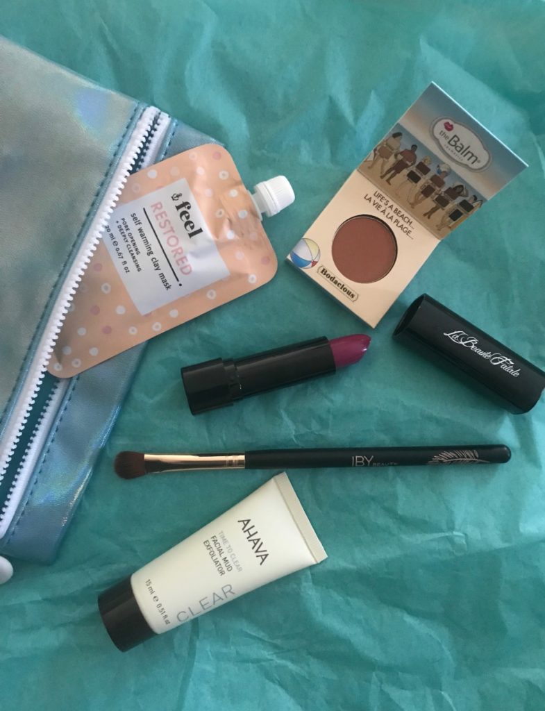 the contents of my Ipsy bag for July 2018 with makeup open to show the shades, neversaydiebeauty.com