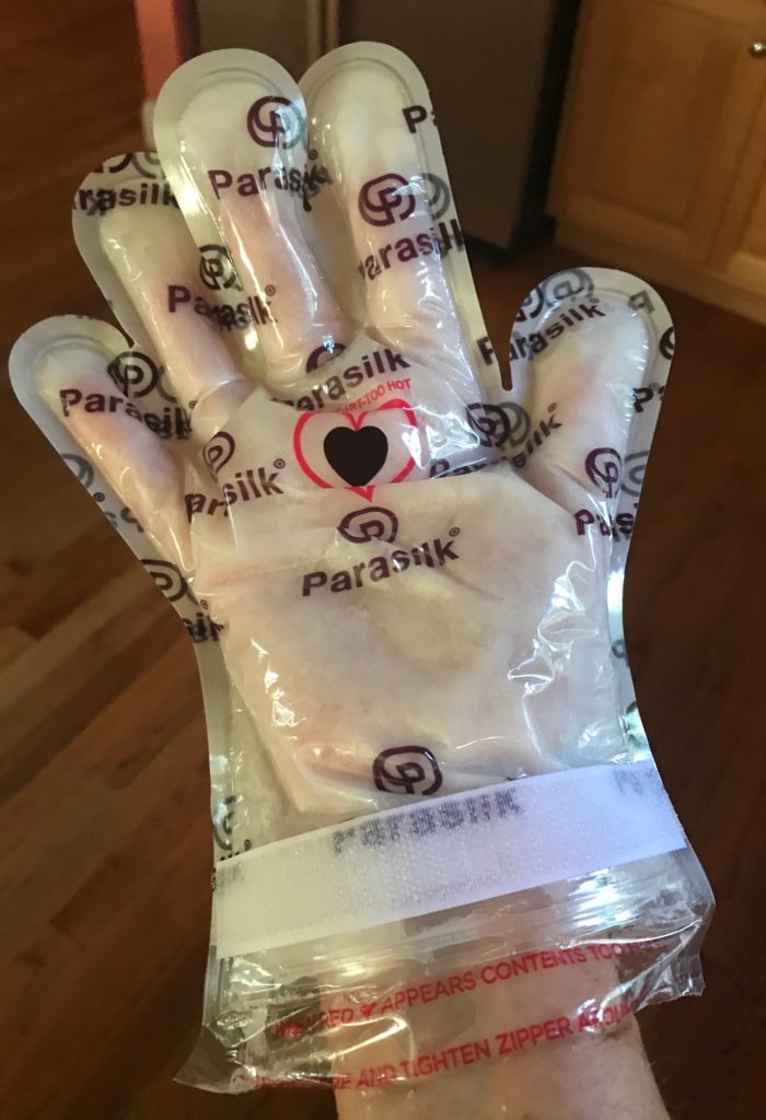 my hand wearing the Parasilk glove treatment, neversaydiebeauty.com
