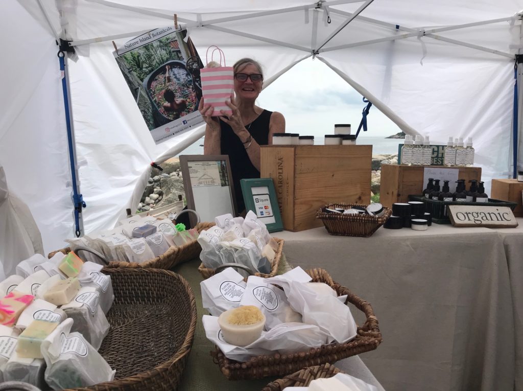 Daphne, owner of Nature Island Botanicals at her tent at Gloucester Waterfront Festival 2018, neversaydiebeauty.com