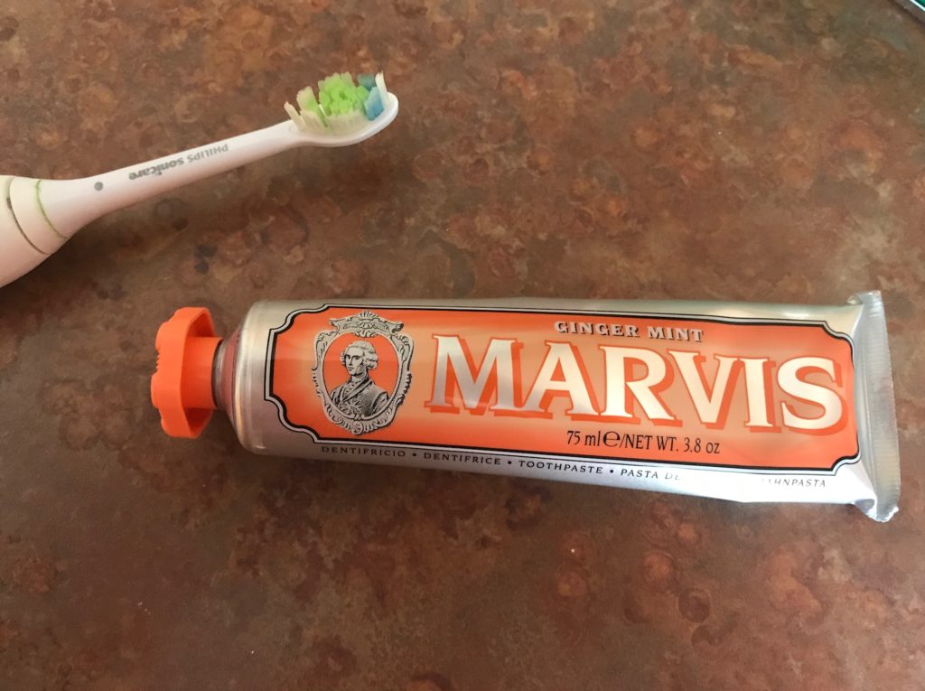 Marvis Ginger Mint toothpaste tube with an orange label and cap, neversaydiebeauty.com
