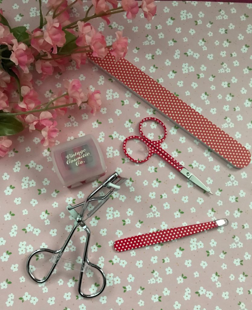 The Vintage Cosmetics Company polka dot beauty tools: emery board, scissors, tweezer, lash curler, duo pencil sharpener, neversaydiebeauty.com