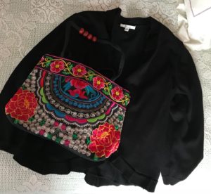 embroidered purse on black sweater, neversaydiebeauty.com