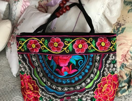 brightly colored embroidered purse, neversaydiebeauty.com