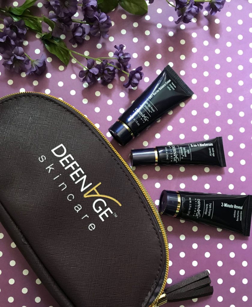 DefenAge Fly Kit with 3 TSA friendly travel size Clinical Power Trio products with a deep purple travel bag, neversaydiebeauty.com
