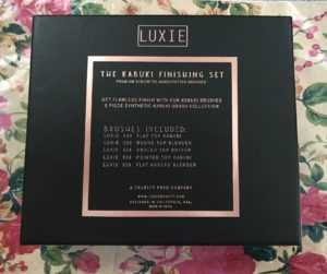 back of the Luxie Rose Gold Kabuki Brush Set box that lists each of the brushes, neversaydiebeauty.com