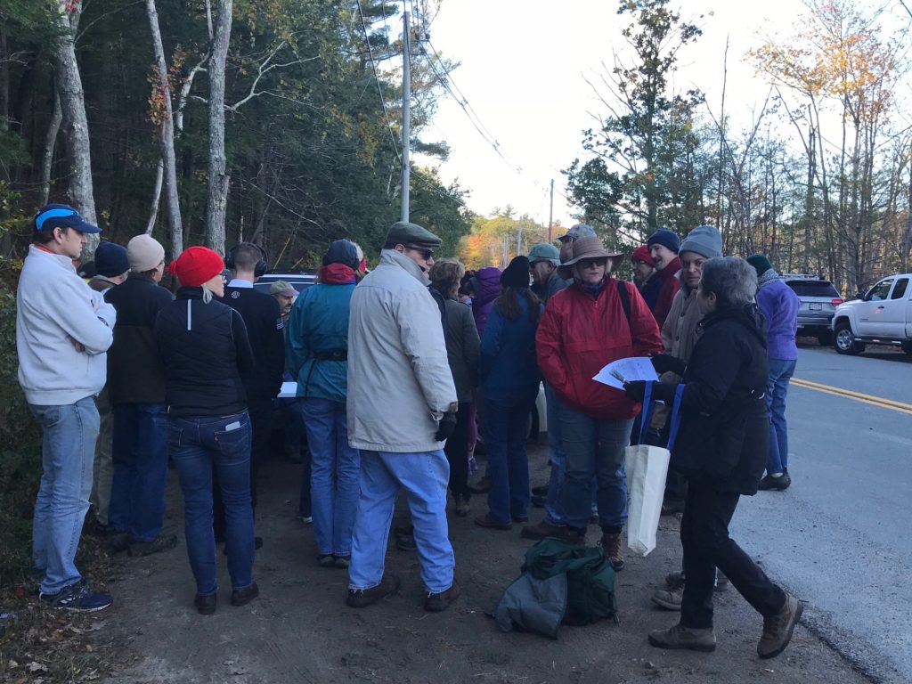 group gathered for a mushroom identification group in the woods 