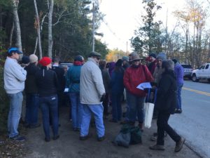 group gathered for a mushroom identification group in the woods