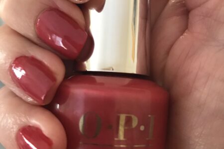 my nails wearing OPI Infinite Shine 2 Grand Canyon Sunset holding the bottle, neversaydiebeauty.com