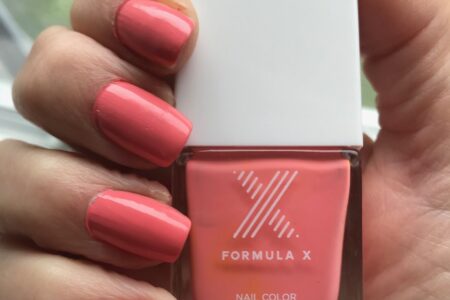 nail swatch and bottle of shade TGIF, a neon peachy pink cream polish from Formula X Nail Polish, neversaydiebeauty.com