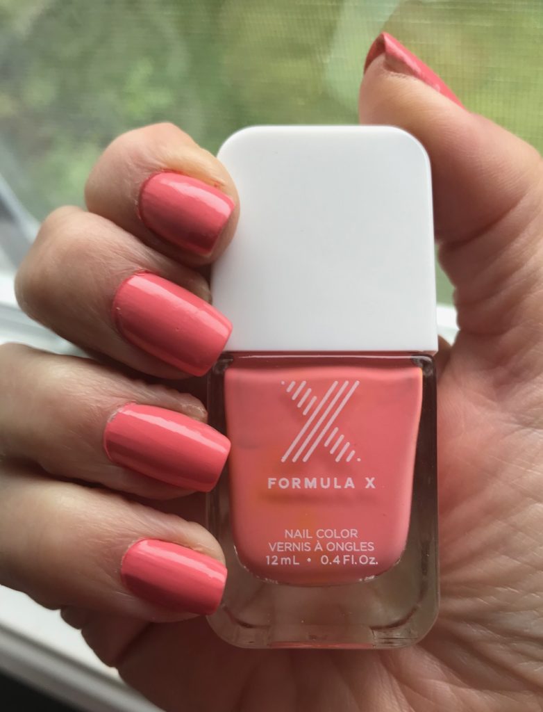 nail swatch and bottle of shade TGIF, a neon peachy pink cream polish from Formula X Nail Polish, neversaydiebeauty.com