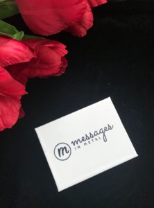 white outer box with name and logo for Messages In Metal, neversaydiebeauty.com